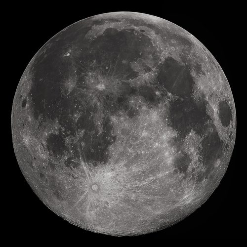 The full Moon, its grey maria and bright rayed craters sharply resolved against black space